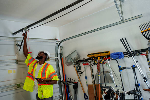 Professional Garage Door Maintenance technician working in Baxter Estates, NY